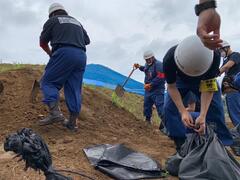 Photo: Sandbag Creation Process