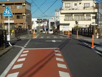 Photo: Deceleration marks, colored pavement, and post cones