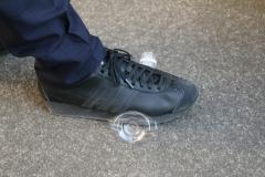 Photo: The act of crushing a plastic bottle with feet