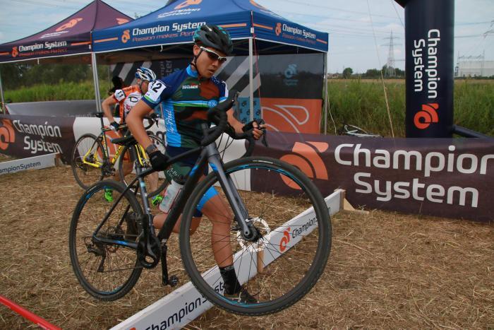 Photo: Athlete carrying a bicycle